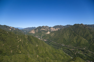 Fototapeta na wymiar Mountain valley. In the background is the Great Wall of China 