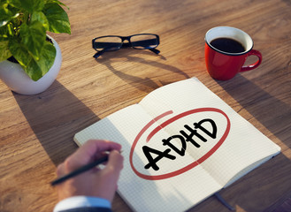 Hand with a Note and a Single Word ADHD - obrazy, fototapety, plakaty