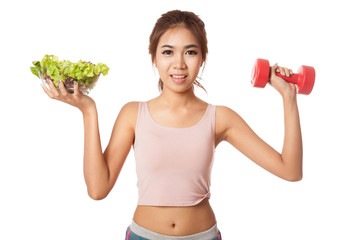 Asian healthy girl with salad bowl and dumbbell