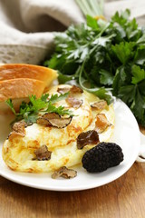 gourmet omelette with black truffle and herbs
