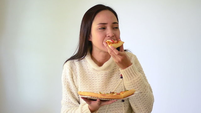 Asian girl show and holding seafood pizza in smile face isolated