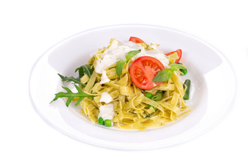 Italian pasta with pesto and herbs.