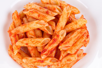 Pasta penne rigate with tomato sauce.