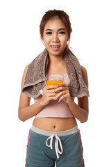 Asian healthy workout girl drinking orange  juice