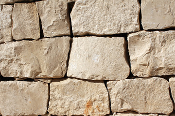 Medieval wall of stone blocks