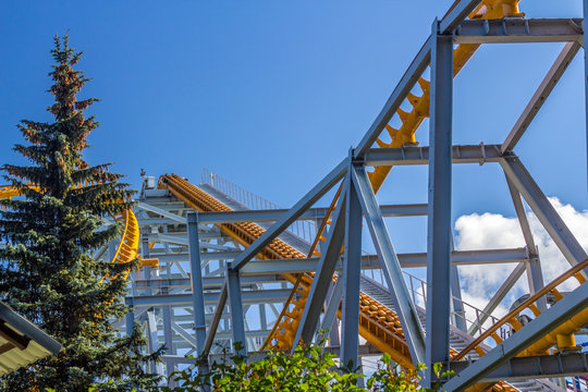 Rollercoaster against blue sky