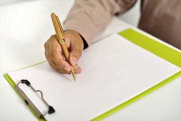 Business Man Writing On Clipboard