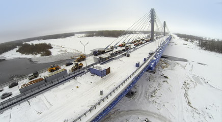 Aerial view to Bridge with construction equipment and cars