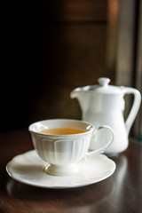 Obraz premium Cup of tea with teapot