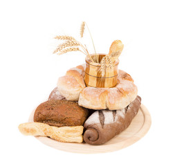 Different breads. Jar and tray of wood. Ears.