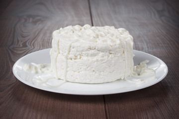 Cottage cheese on wooden table