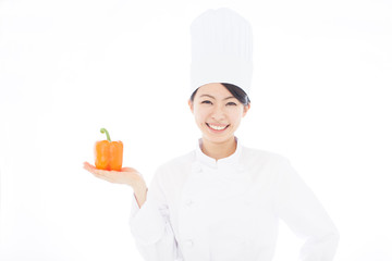 パプリカを持った女性