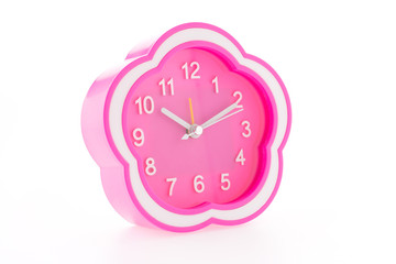 Pink alarm clock isolated on white background