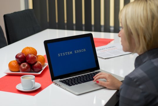 Blonde woman having a computer error