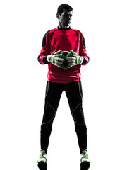 caucasian soccer player goalkeeper man  holding ball silhouette