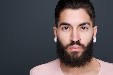 Young man with beard and piercings