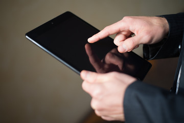 man holding digital tablet, closeup