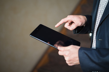 man holding digital tablet, closeup