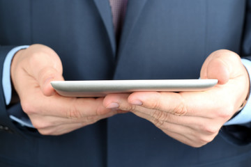 Businessman holding  a digital tablet