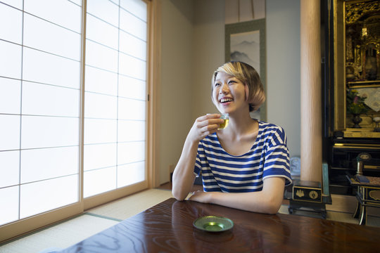 A woman sitting at a table.