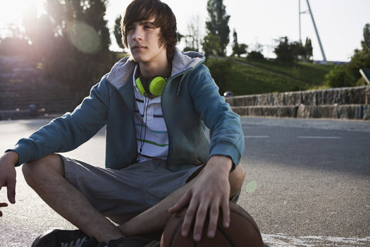 Germany, Berlin, Teenage boy with headphones