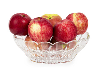 Red apples in a glass vase