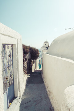 Greece, Cyclades, Santorini, Thera, alley with church in the background