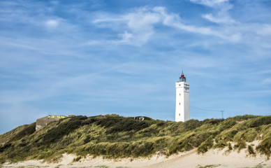 Fototapeta na wymiar Lighthouse in Blaavand at the Dansih North Sea coast