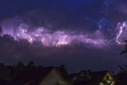 Germany, Hamburg, dramatic night sky at heavy thunderstorm