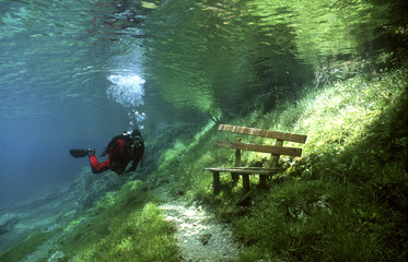 Austria, Styria, Tragoess, lake Gruener See, diver in front of a park bench