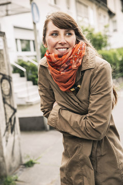 Portrait of freezing woman wearing orange scarf