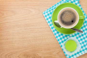 Cup of coffee and fresh macaroon