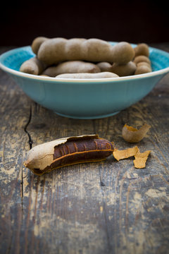 Bowl of tamarinds Tamarindus indica on wooden table
