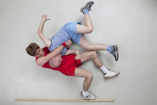 Two men wrestling
