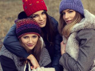 Portrait of happy women in woolly hats