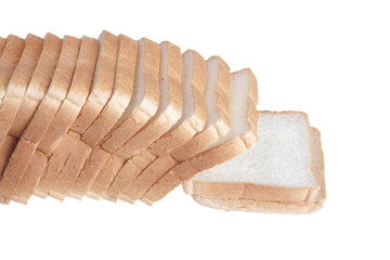 slicing a loaf of white bread isolated on a white background
