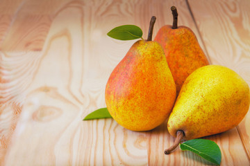 sweet pear closeup on wooden background 