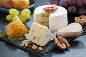 delicious Camembert with fresh honey and nuts, close-up