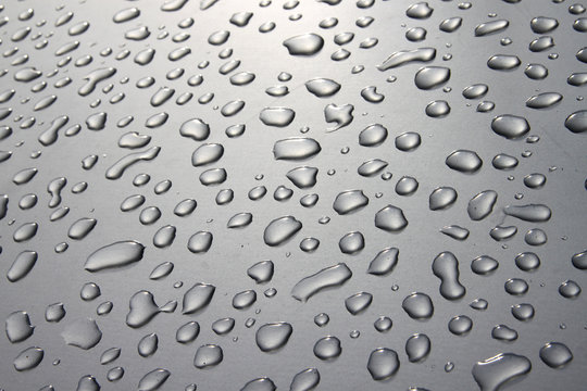 Raindrops On Silver Surface