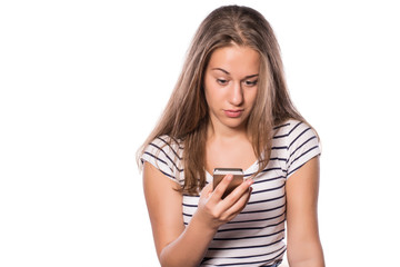 Young girl texting on smart phone