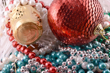 Beautiful ornaments, champagne, pearl and balls as a New Year