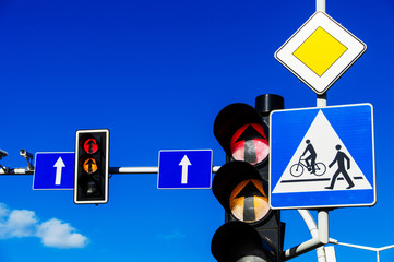 Traffic lights over blue sky