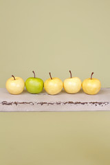 Row of Apples on Rustic Wood Bench