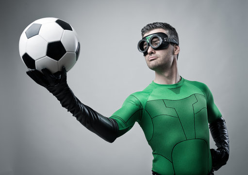 Superhero with soccer ball