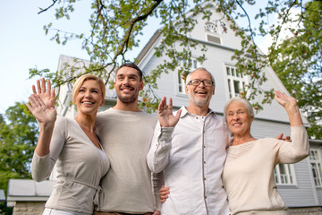 happy family in front of house outdoors
