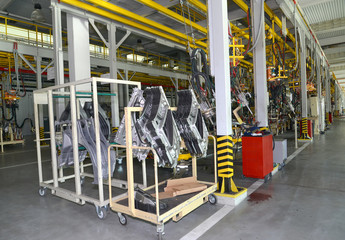 Fototapeta na wymiar Car body details in welding shop of automobile plant