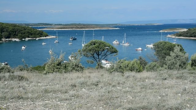 Sailboats in a bay in Kamenjak National Park, Istria, Croatia