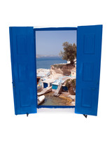 Open traditional Greek blue window on Milos island, Greece