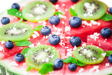 Watermelon pizza on white