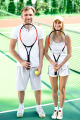 Young couple playing tennis